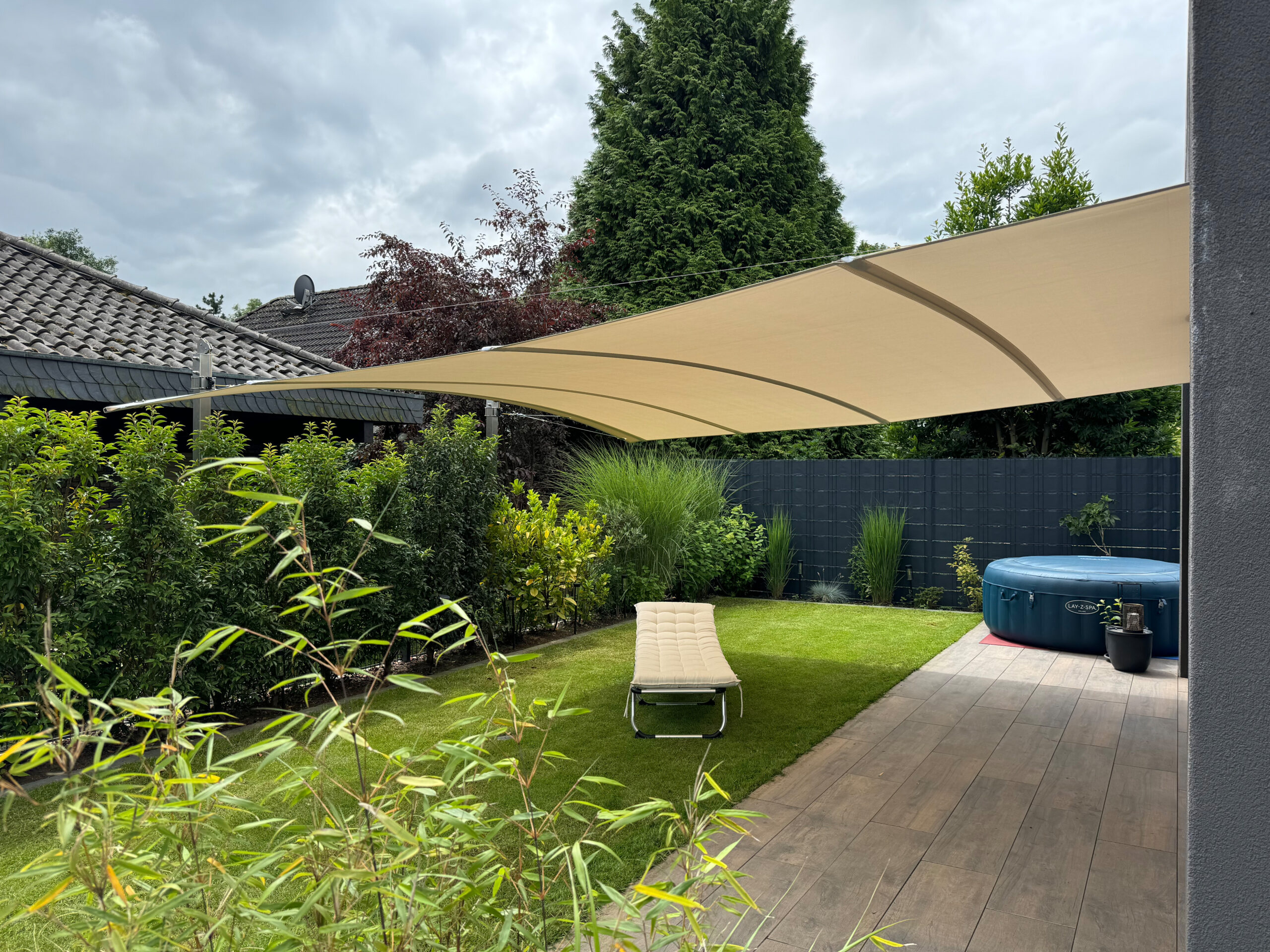 Öhrra retractable shade sail installed over an outdoor living area