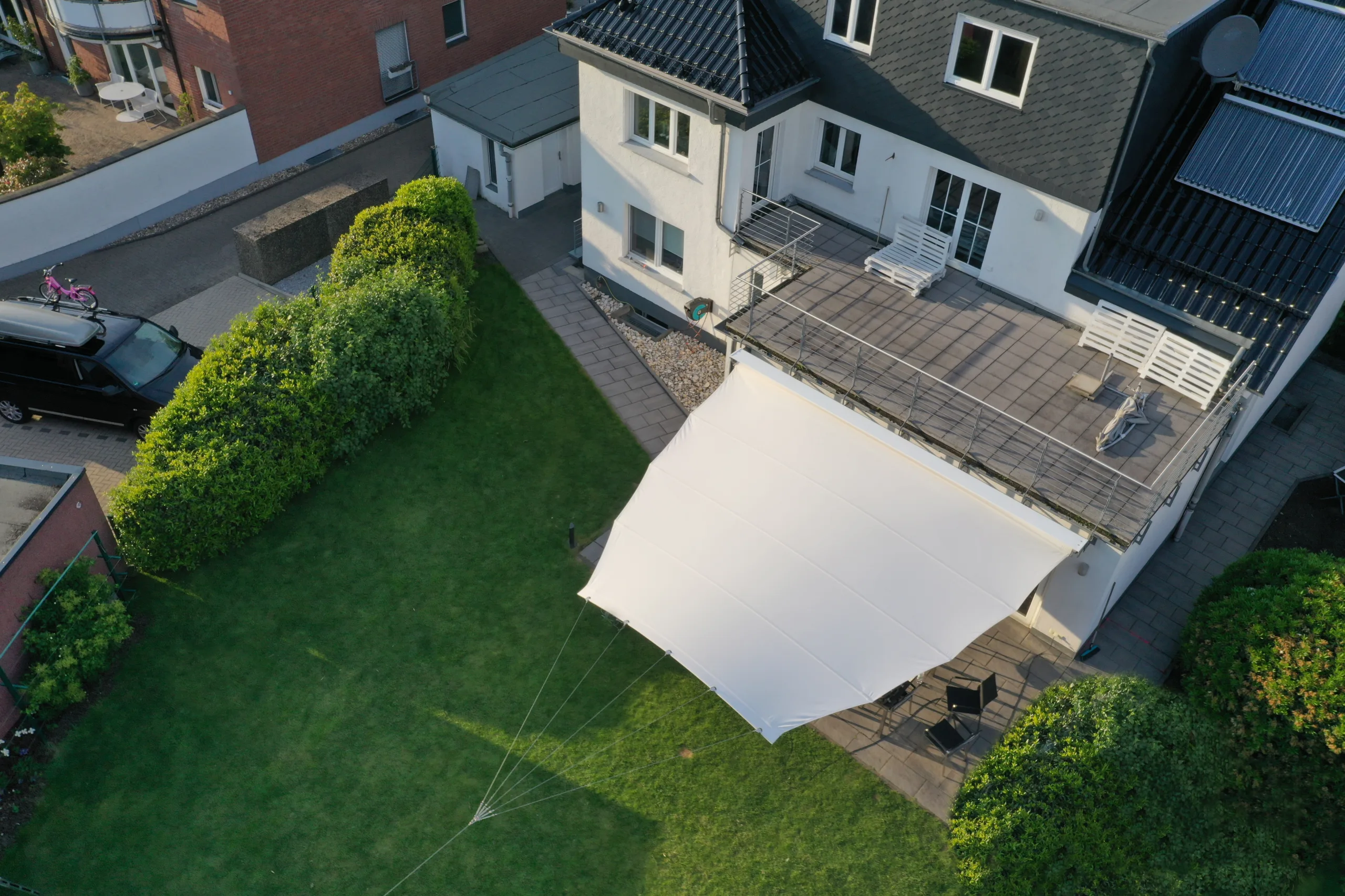 Öhrra One retractable shade sail measuring 6.5 by 5.5 metres on a design mast